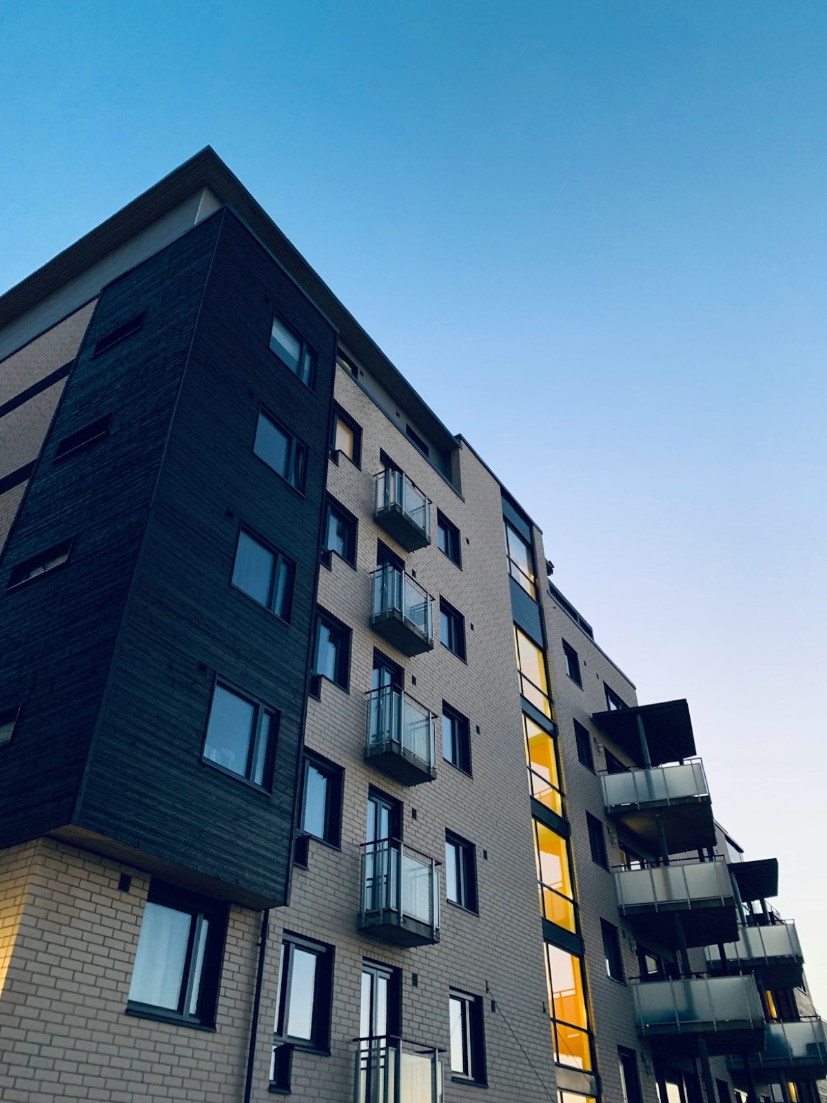 Modern mid-rise apartment building with balconies