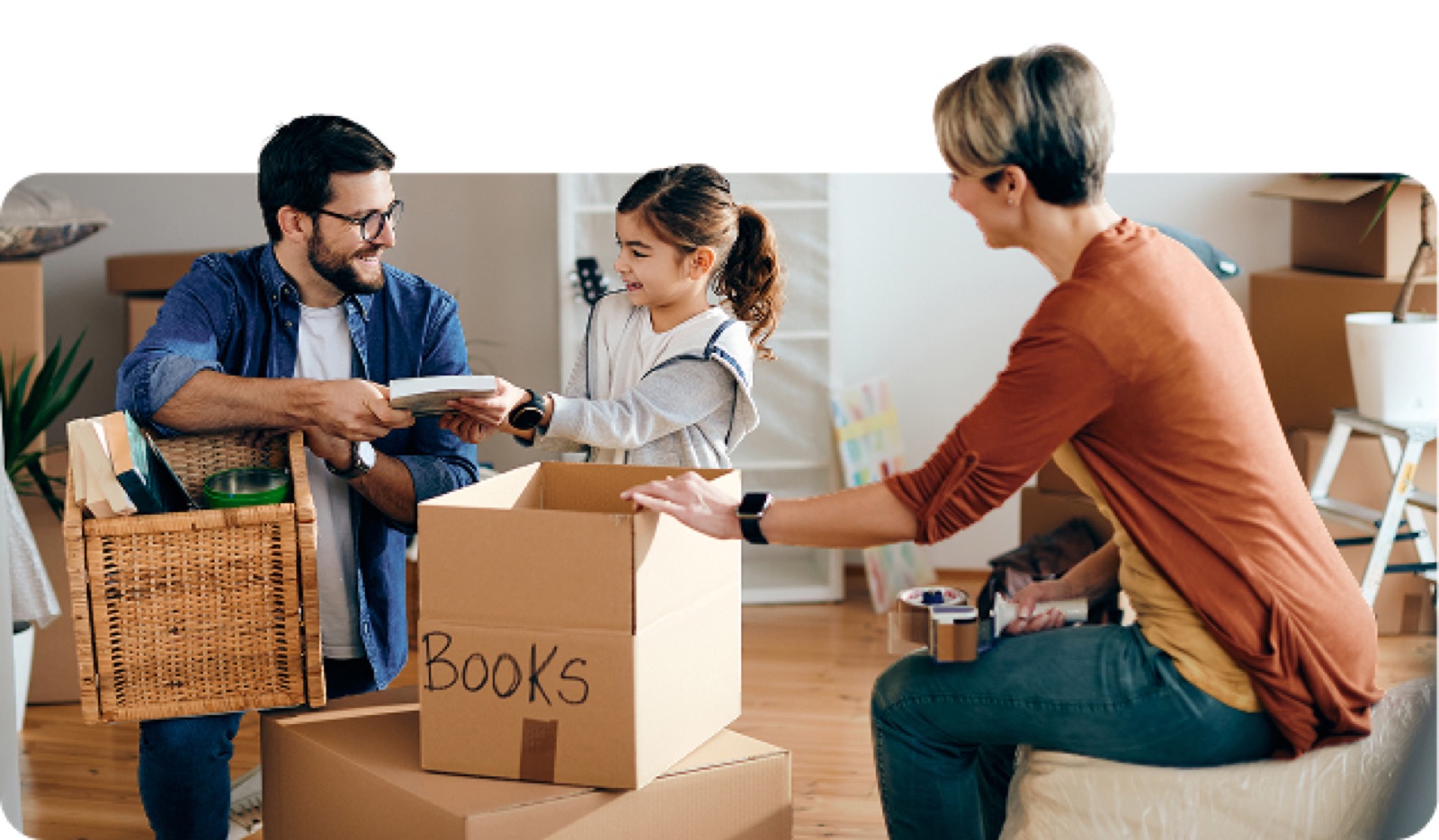 Family unpacking boxes in their new home