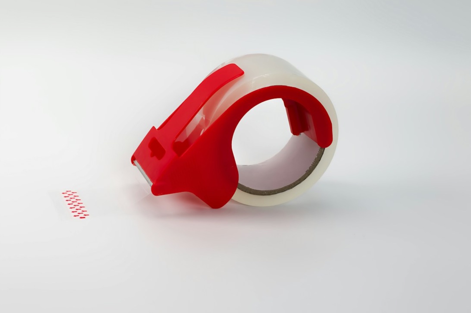Red tape dispenser with packing tape